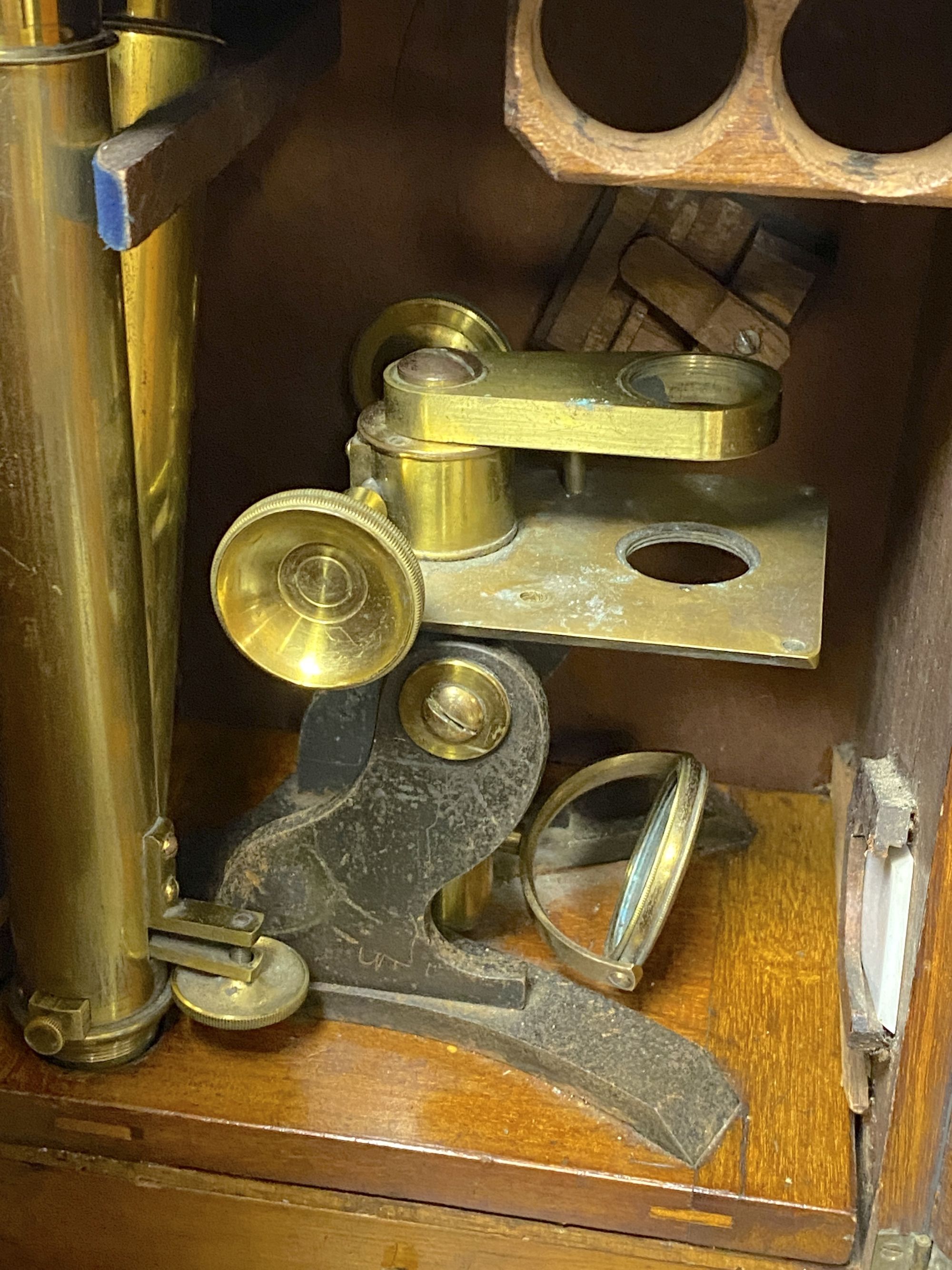 An early 20th century lacquered brass binocular microsope (unnamed) and two other microscopes by Watson & Sons, H 33cm approx